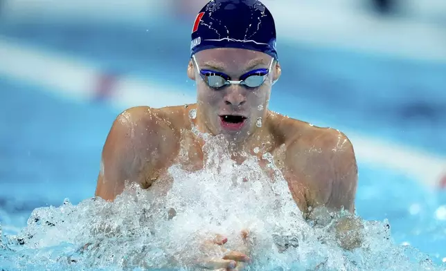 Leon Marchand from France competes in a men's 4x100-meter medley relay heat at the Summer Olympics in Nanterre, France, Saturday, Aug. 3, 2024. (AP Photo/Natacha Pisarenko)