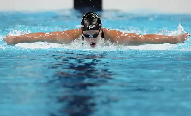 Summer McIntosh, of Canada, competes in the women's 200-meter butterfly final at the 2024 Summer Olympics, Thursday, Aug. 1, 2024, in Nanterre, France. (AP Photo/Matthias Schrader)