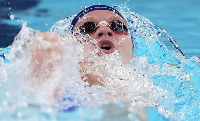 Leon Marchand, of France, competes in a heat of the men's 200-meter individual medley at the 2024 Summer Olympics, Thursday, Aug. 1, 2024, in Nanterre, France. (AP Photo/Matthias Schrader)