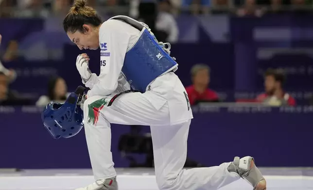 Bulgaria's Kimia Alizadeh Zenozi reacts at the end of a women's 57kg Taekwondo match against Iran's Nahid Kiyanichandeh during the 2024 Summer Olympics, at the Grand Palais, Thursday, Aug. 8, 2024, in Paris, France. (AP Photo/Andrew Medichini)