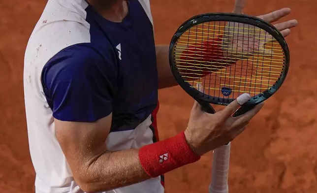 Casper Ruud of Norway reacts as he plays against Felix Auger-Aliassime of Canada during their men's singles quarterfinals tennis match, at the 2024 Summer Olympics, Thursday, Aug.1, 2024, at the Roland Garros stadium in Paris, France. (AP Photo/Andy Wong)