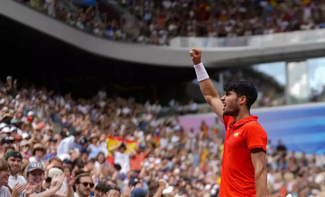 Carlos Alcaraz of Spain celebrates a point against Tommy Paul, of United States during their men's quarter-final match at the Roland Garros stadium, at the 2024 Summer Olympics, Thursday, Aug. 1, 2024, in Paris, France. (AP Photo/Manu Fernandez)