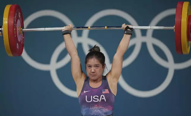 Jourdan Delacruz of the United States competes during the women's 49kg weightlifting event at the 2024 Summer Olympics, Wednesday, Aug. 7, 2024, in Paris, France. (AP Photo/Kin Cheung)