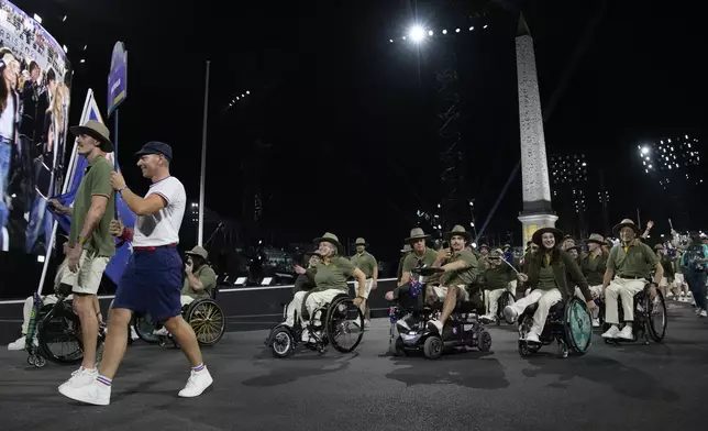 Members of the Australian delegation parade during the Opening Ceremony for the 2024 Paralympics, Wednesday, Aug. 28, 2024, on Concorde plaza in Paris, France. (AP Photo/Christophe Ena)