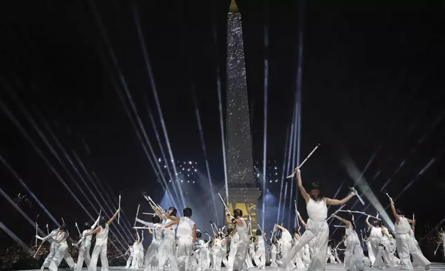 Artists perform during the Opening Ceremony for the 2024 Paralympics, Wednesday, Aug. 28, 2024, at La Concorde square in Paris, France. (AP Photo/Thibault Camus, Pool)