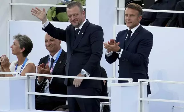 French President Emmanuel Macron, right, and IPC president Andrew Parson attend the Opening Ceremony for the 2024 Paralympics, Wednesday, Aug. 28, 2024, in Paris, France. (AP Photo/Emilio Morenatti)