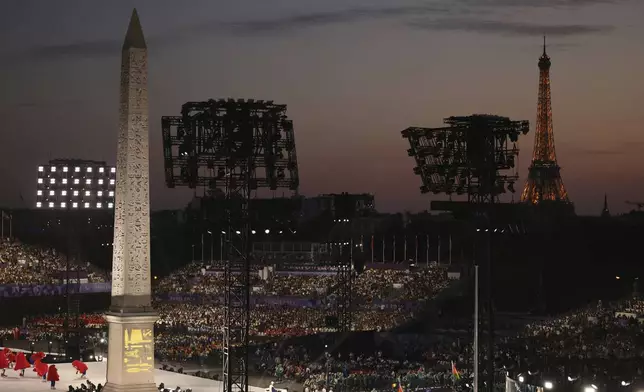 The crowd attends the Opening Ceremony for the 2024 Paralympics, Wednesday, Aug. 28, 2024, on the Concorde plaza in Paris, France. (AP Photo/Thomas Padilla)