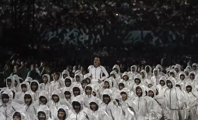 Artists perform during the Opening Ceremony for the 2024 Paralympics, Wednesday, Aug. 28, 2024, in Paris, France. (AP Photo/Thibault Camus, Pool)