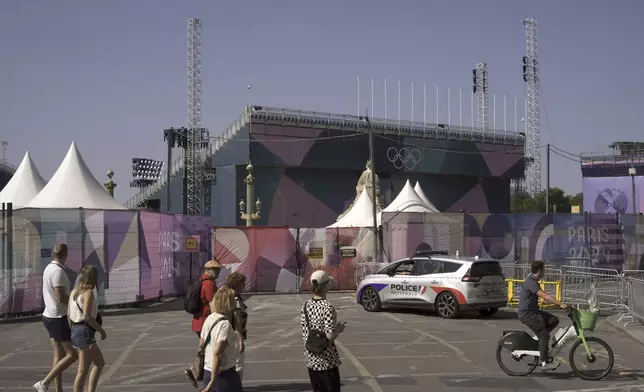 FILE - A police car on the Place de la Concorde ahead of the Paralympic Games, Thursday, Aug. 22, 2024 in Paris. With the Olympics behind it, Paris is getting ready for the next big sporting event on the calendar this summer: the Paralympics. (AP Photo/Thibault Camus, File)