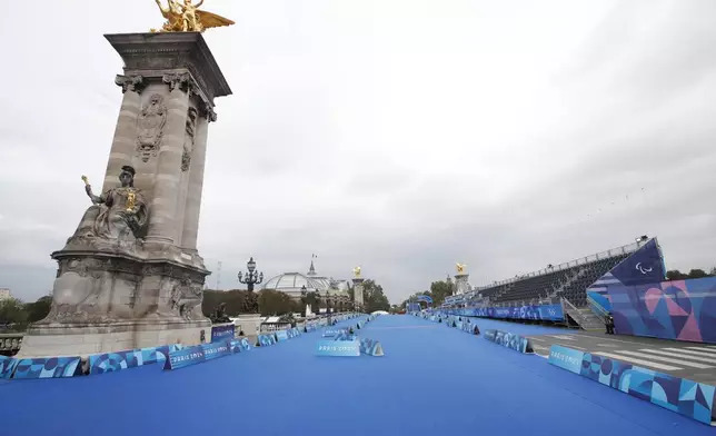 The Alexandre III bridge which will be used for the Para Triathlon, ahead of the Paralympic Games, Tuesday, Aug. 20, 2024 in Paris. With the Olympics behind it, Paris is getting ready for the next big sporting event on the calendar this summer: the Paralympics. (AP Photo/Aurelien Morissard, File)