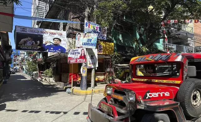 A banner congratulating Filipino gymnast Carlo Yulo, who won two gold medals in the Paris Olympics, is displayed in Leveriza, Pasay City, Manila, Philippines where Yulo grew up, on Tuesday, Aug 13, 2024. (AP Photo/Joeal Calupitan)