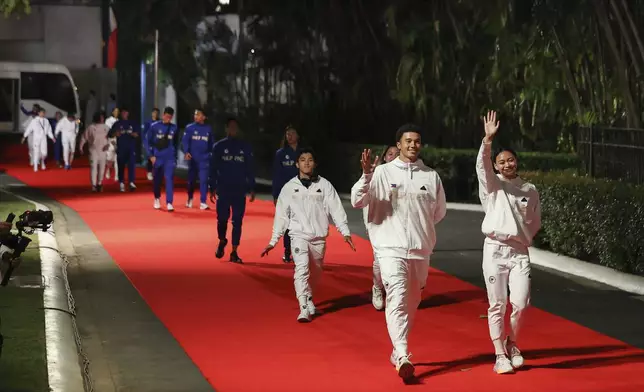 Filipino athletes who competed in the Paris Olympics arrive during a welcome ceremony at the Malcañang presidential palace in Manila, Philippines on Tuesday, Aug. 13, 2024. (AP Photo/Basilio Sepe, Pool)