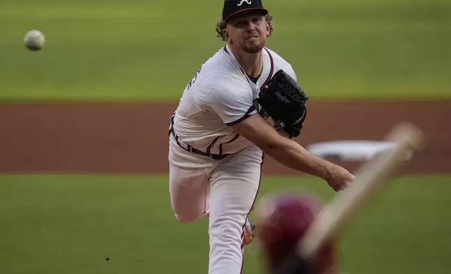 Atlanta Braves pitcher Spencer Schwellenbach (56) delivers against the Philadelphia Phillies in the first inning of a baseball game, Thursday, Aug. 22, 2024, in Atlanta. (AP Photo/Mike Stewart)