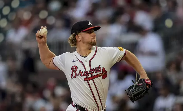 Atlanta Braves pitcher Spencer Schwellenbach (56) deloivers against the Philadelphia Phillies in the second inning of a baseball game, Thursday, Aug. 22, 2024, in Atlanta. (AP Photo/Mike Stewart)