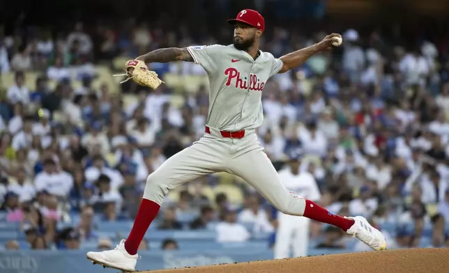 Philadelphia Phillies starting pitcher Cristopher Sánchez delivers a pitch during the first inning of a baseball game against the Los Angeles Dodgers in Los Angeles, Tuesday, Aug. 6, 2024. (AP Photo/Kyusung Gong)