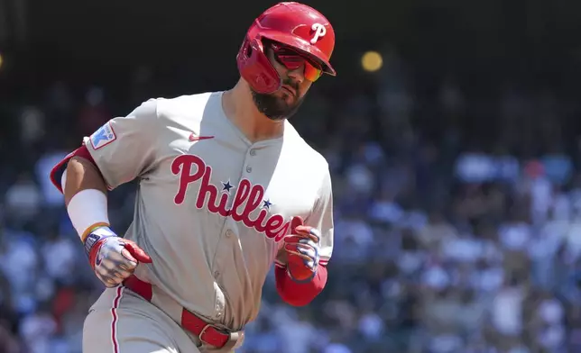 Philadelphia Phillies' Jeff Hoffman runs the bases after hitting a home run off of a pitch from Seattle Mariners pitcher Logan Gilbert during the first inning of a baseball game, Sunday, Aug. 4, 2024, in Seattle. (AP Photo/Liv Lyons)