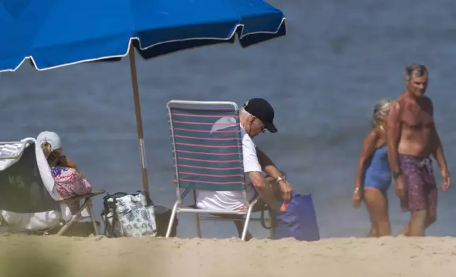 President Joe Biden and first lady Jill Biden lounge on the beach in Rehoboth Beach, Del., Aug. 28, 2024. (AP Photo/Manuel Balce Ceneta)