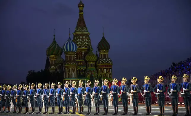 Presidential regiment soldiers perform during the Spasskaya Tower International Military Music Festival in Red Square, backdropped by the St. Basil Cathedral, in Moscow, Aug. 23, 2024. (AP Photo/Alexander Zemlianichenko)