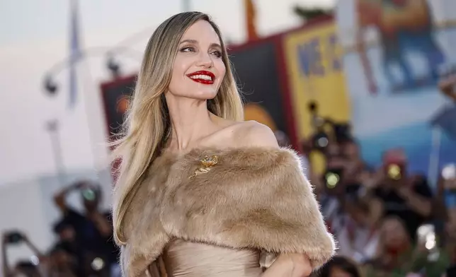 Angelina Jolie poses for photographers upon her arrival for the premiere of the film 'Maria' during the 81st edition of the Venice Film Festival in Venice, Italy, Aug. 29, 2024. (Photo by Joel C Ryan/Invision/AP)