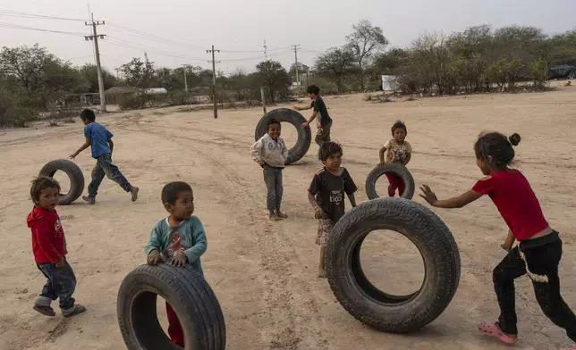 Manjui Indigenous children play in the Abisai community in Mariscal Estigarribia, in the western region of Paraguay known as the Paraguayan Chaco, Wednesday, Aug. 28, 2024. (AP Photo/Rodrigo Abd)