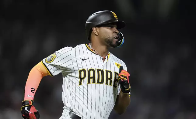 San Diego Padres' Xander Bogaerts watches his RBI single during the seventh inning of a baseball game against the Pittsburgh Pirates, Monday, Aug. 12, 2024, in San Diego. (AP Photo/Gregory Bull)