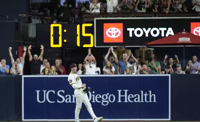 San Diego Padres center fielder Jackson Merrill celebrates after making a catch for the out on Pittsburgh Pirates' Bryan Reynolds to end the baseball game Monday, Aug. 12, 2024, in San Diego. The Padres won, 2-1. (AP Photo/Gregory Bull)