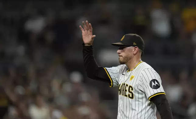 San Diego Padres starting pitcher Joe Musgrove waves to the crowd after exiting during the fifth inning of a baseball game against the Pittsburgh Pirates, Monday, Aug. 12, 2024, in San Diego. (AP Photo/Gregory Bull)