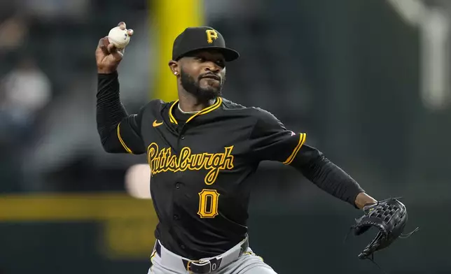 Pittsburgh Pirates starting pitcher Domingo German throws to the Texas Rangers in the first inning of a baseball game, Wednesday, Aug. 21, 2024, in Arlington, Texas. (AP Photo/Tony Gutierrez)