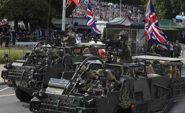 British troops from NATO member Poland and some of its allies showcase military equipment during the yearly observances on Poland's armed forces holiday in Warsaw, Poland, on Thursday, Aug. 15, 2024. (AP Photo/Czarek Sokolowski)