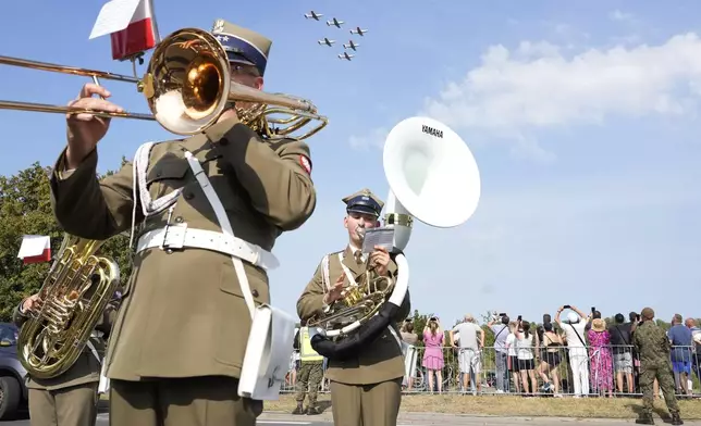 A band plays during a Polish military parade on the occasion of the armed forces day, in Warsaw, Poland, on Thursday, Aug. 15, 2024. (AP Photo/Czarek Sokolowski)