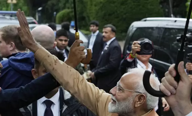 Indian Prime Minister Narendra Modi waves during a wreath laying ceremony in honour of the "Good Maharaja" Jam Sahib of Nawanagar, in Warsaw, Poland, Wednesday, Aug. 21, 2024. Modi is visiting Poland for top-level security and trade talks before heading to neighboring Ukraine, which is at war with India's strategic partner, Russia. (AP Photo/Czarek Sokolowski)