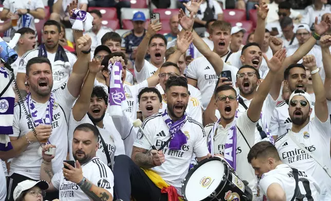 Real Madrid's fans cheer before the UEFA Super Cup Final soccer match between Real Madrid and Atalanta at the Narodowy stadium in Warsaw, Poland, Wednesday, Aug. 14, 2024. (AP Photo/Czarek Sokolowski)