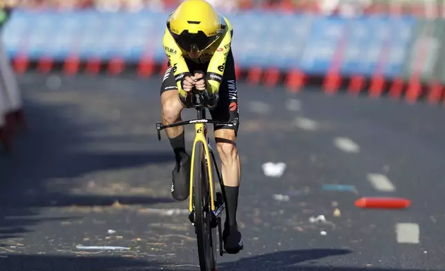 Sepp Kuss, of the United States, competes in the first stage of the tour of Spain, La Vuelta, cycling race, an individual time trial with start in Lisbon and finish in Oeiras, Portugal, Saturday, Aug. 17, 2024. (AP Photo/Pedro Rocha)