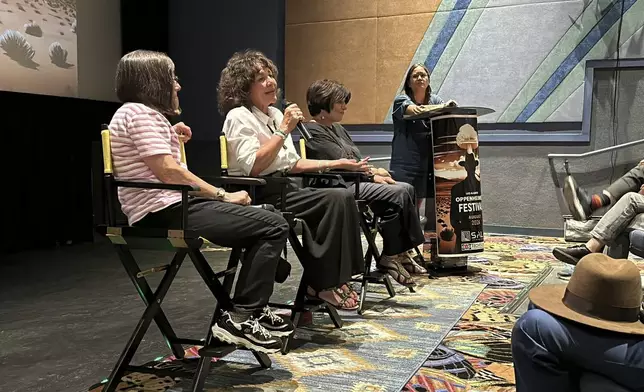 Cancer survivor and Tularosa Basin Downwinders Consortium founder Tina Cordova, center, answer questions during a discussion following the first screening of "First We Bombed New Mexico" during the Oppenheimer Film Festival in Los Alamos, New Mexico, on Saturday, Aug. 17, 2024. (AP Photo/Susan Montoya Bryan)