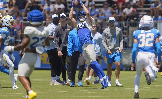 Los Angeles Rams wide receiver Cooper Kupp (10) catches a pass during NFL football practice at The Bolt in El Segundo, Calif., on Sunday, August 4, 2024. The Rams and Chargers are having joint practices. (AP Photo/Damian Dovarganes)