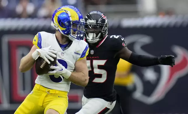 Los Angeles Rams wide receiver Drake Stoops (6) catches a pass in front of Houston Texans cornerback Desmond King II (25) during the first half of a preseason NFL football game, Saturday, Aug. 24, 2024, in Houston. (AP Photo/Eric Gay)