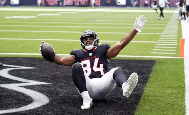 Houston Texans fullback Troy Hairston (34) celebrates after scoring on a 5-yard touchdown reception during the first half of a preseason NFL football game against the Los Angeles Rams, Saturday, Aug. 24, 2024, in Houston. (AP Photo/Eric Christian Smith)