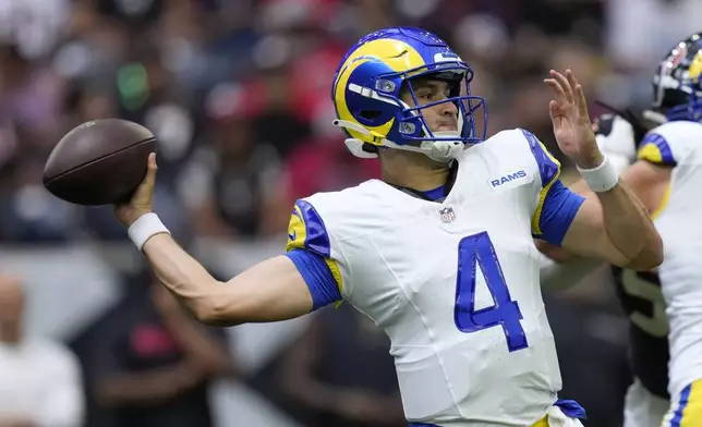 Los Angeles Rams quarterback Dresser Winn (4) throws a pass during the first half of a preseason NFL football game against the Houston Texans, Saturday, Aug. 24, 2024, in Houston. (AP Photo/Eric Gay)