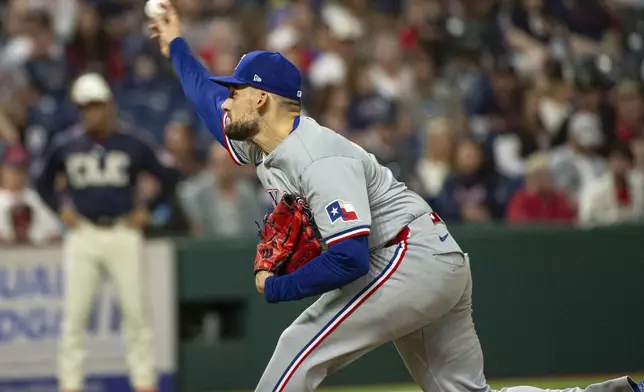 Texas Rangers starting pitcher Nathan Eovaldi delivers against the Cleveland Guardians during the sixth inning of a baseball game in Cleveland, Friday, Aug. 23, 2024. (AP Photo/Phil Long)