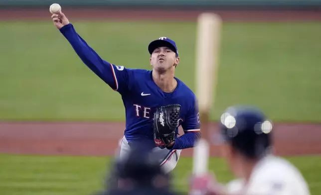 Texas Rangers pitcher Tyler Mahle delivers during the first inning of a baseball game against the Boston Red Sox at Fenway Park, Monday, Aug. 12, 2024, in Boston. (AP Photo/Charles Krupa)