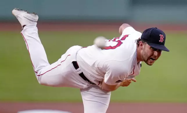 Boston Red Sox pitcher Kutter Crawford delivers during the first inning of a baseball game against the Texas Rangers at Fenway Park, Tuesday, Aug. 13, 2024, in Boston. (AP Photo/Charles Krupa)