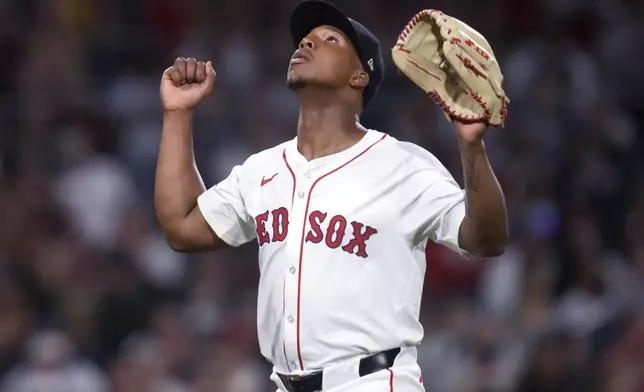 Boston Red Sox pitcher Brayan Bello celebrates after striking out Texas Rangers' Adolis García to end the top of the fifth inning of a baseball game at Fenway Park, Monday, Aug. 12, 2024, in Boston. (AP Photo/Charles Krupa)