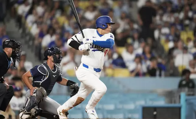 Los Angeles Dodgers designated hitter Shohei Ohtani (17) grounds out during the fifth inning of a baseball game in Los Angeles, Friday, Aug. 23, 2024. (AP Photo/Ashley Landis)