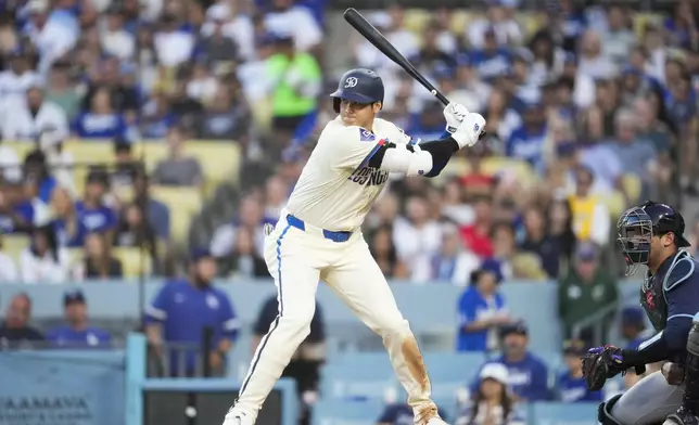 Los Angeles Dodgers designated hitter Shohei Ohtani waits for a pitch during the fourth inning of a baseball game against the Tampa Bay Rays in Los Angeles, Saturday, Aug. 24, 2024. (AP Photo/Ashley Landis)