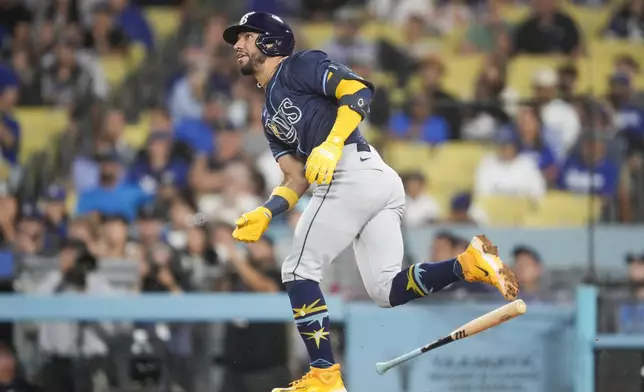 Tampa Bay Rays' José Caballero runs after hitting a home run during the tenth inning of a baseball game against the Los Angeles Dodgers in Los Angeles, Saturday, Aug. 24, 2024. Jonny DeLuca also scored. (AP Photo/Ashley Landis)