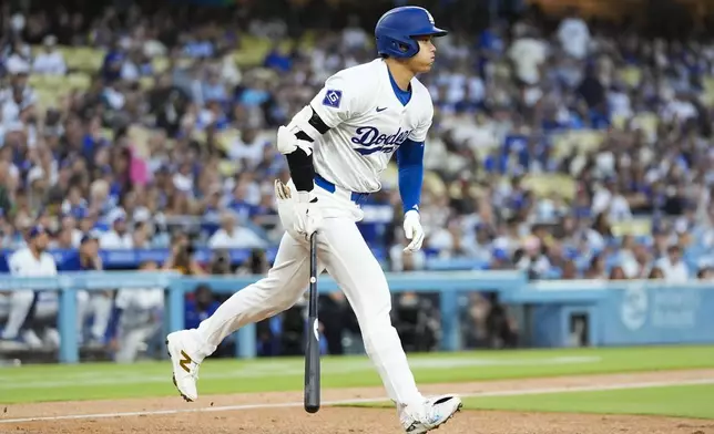 Los Angeles Dodgers designated hitter Shohei Ohtani (17) reacts as he lines out during the first inning of a baseball game against the Tampa Bay Rays in Los Angeles, Friday, Aug. 23, 2024. (AP Photo/Ashley Landis)