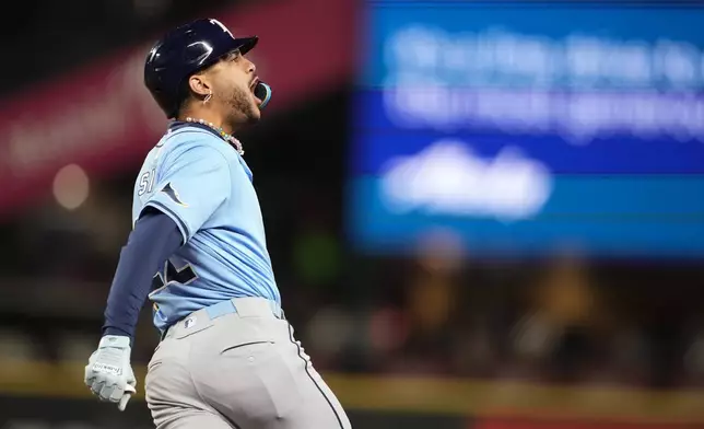 Tampa Bay Rays' Jose Siri reacts to hitting a two-run home run against the Seattle Mariners during the seventh inning of a baseball game, Tuesday, Aug. 27, 2024, in Seattle. (AP Photo/Lindsey Wasson)