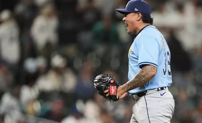 Tampa Bay Rays relief pitcher Manuel Rodriguez reacts to earning the save in a 3-2 win over the Seattle Mariners in a baseball game, Tuesday, Aug. 27, 2024, in Seattle. (AP Photo/Lindsey Wasson)