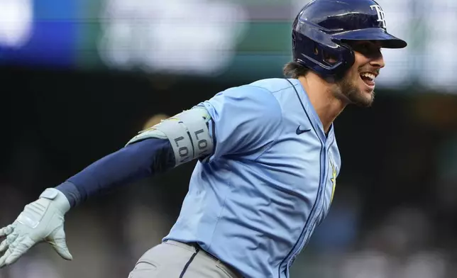 Tampa Bay Rays' Josh Lowe rounds the bases after hitting a solo home run against the Seattle Mariners during the second inning of a baseball game Monday, Aug. 26, 2024, in Seattle. (AP Photo/Lindsey Wasson)