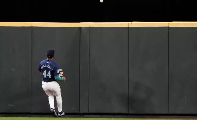 Seattle Mariners center fielder Julio Rodríguez watches the two-run home run from Tampa Bay Rays' Jose Siri go over the wall during the seventh inning of a baseball game, Tuesday, Aug. 27, 2024, in Seattle. (AP Photo/Lindsey Wasson)